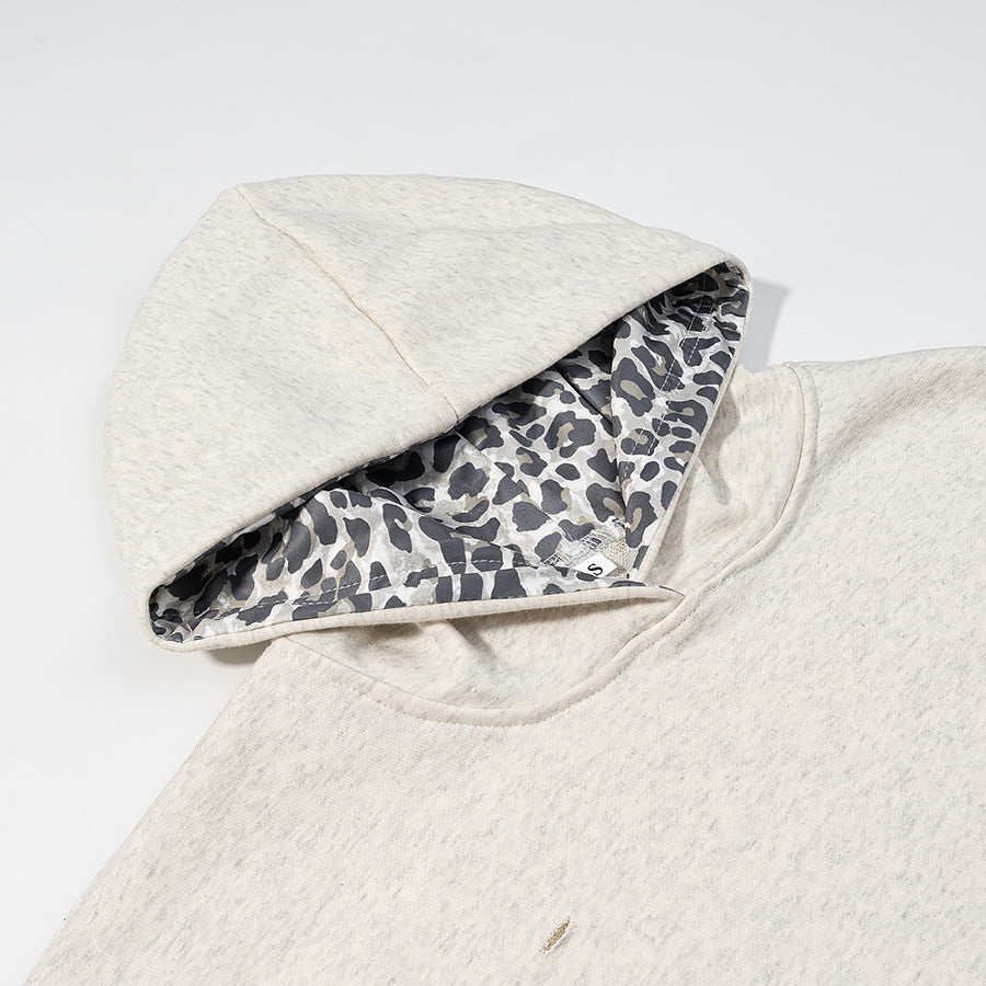 Animal pattern patchwork perforated hooded sweatshirt