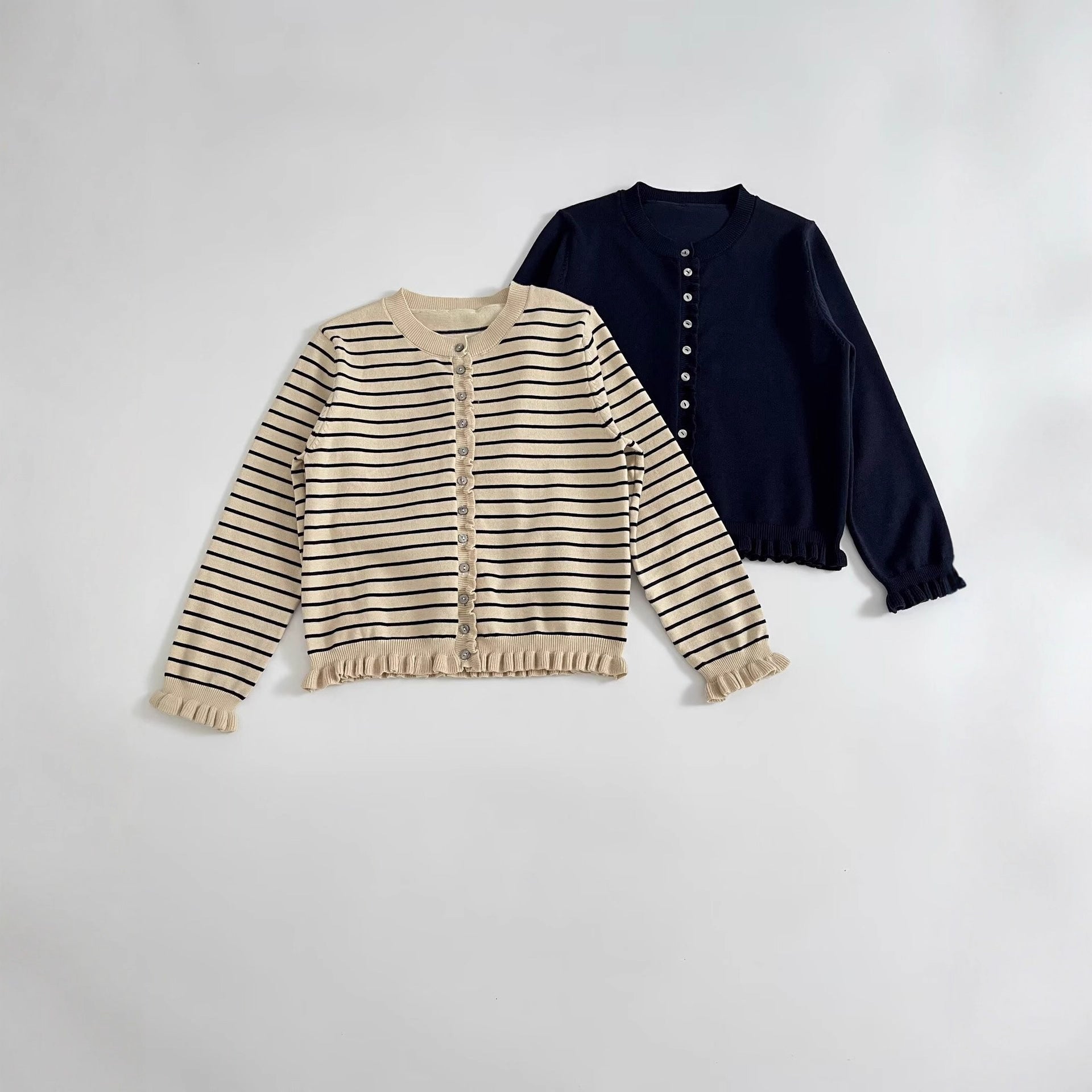 Stacked decorative round neck long sleeved knitted jacket